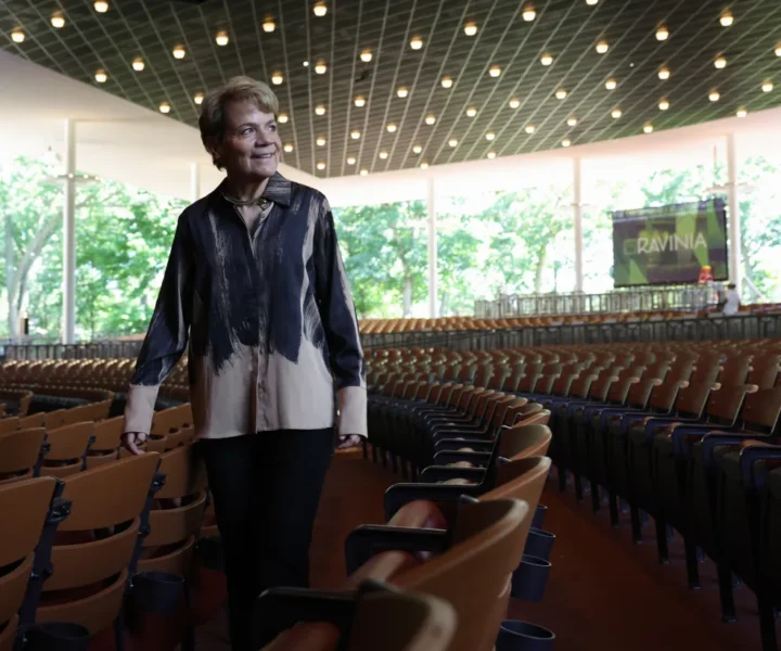 Ravinia Festival chief conductor Marin Alsop checks out the renovated seats of the pavilion on July 7, 2026, in Highland Park. (John J. Kim/Chicago Tribune)